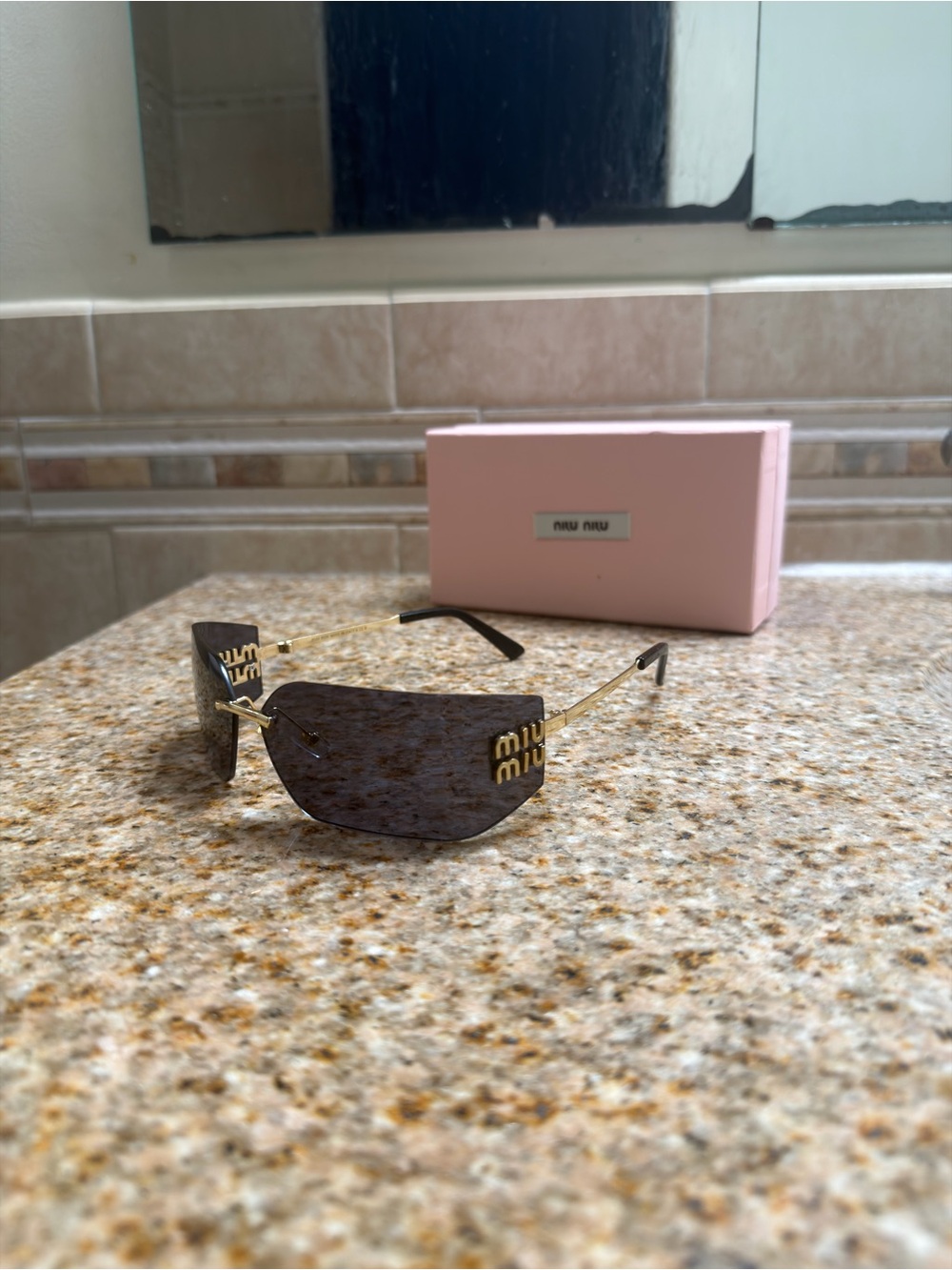 Miu Miu Rimless Sunglasses with Black Lenses and Gold Temples
